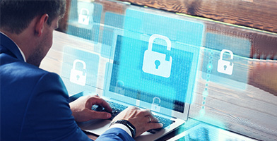 Man with Laptop and Online Security