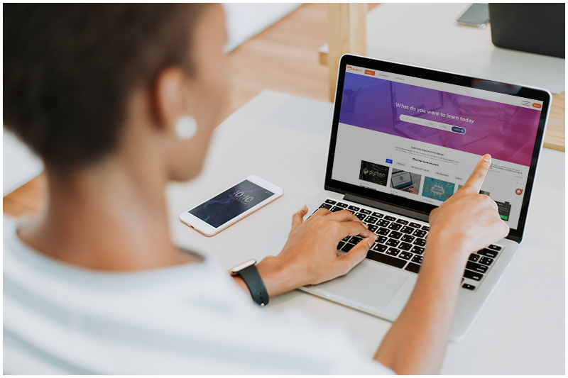 Woman Using Edusity Website on a Laptop